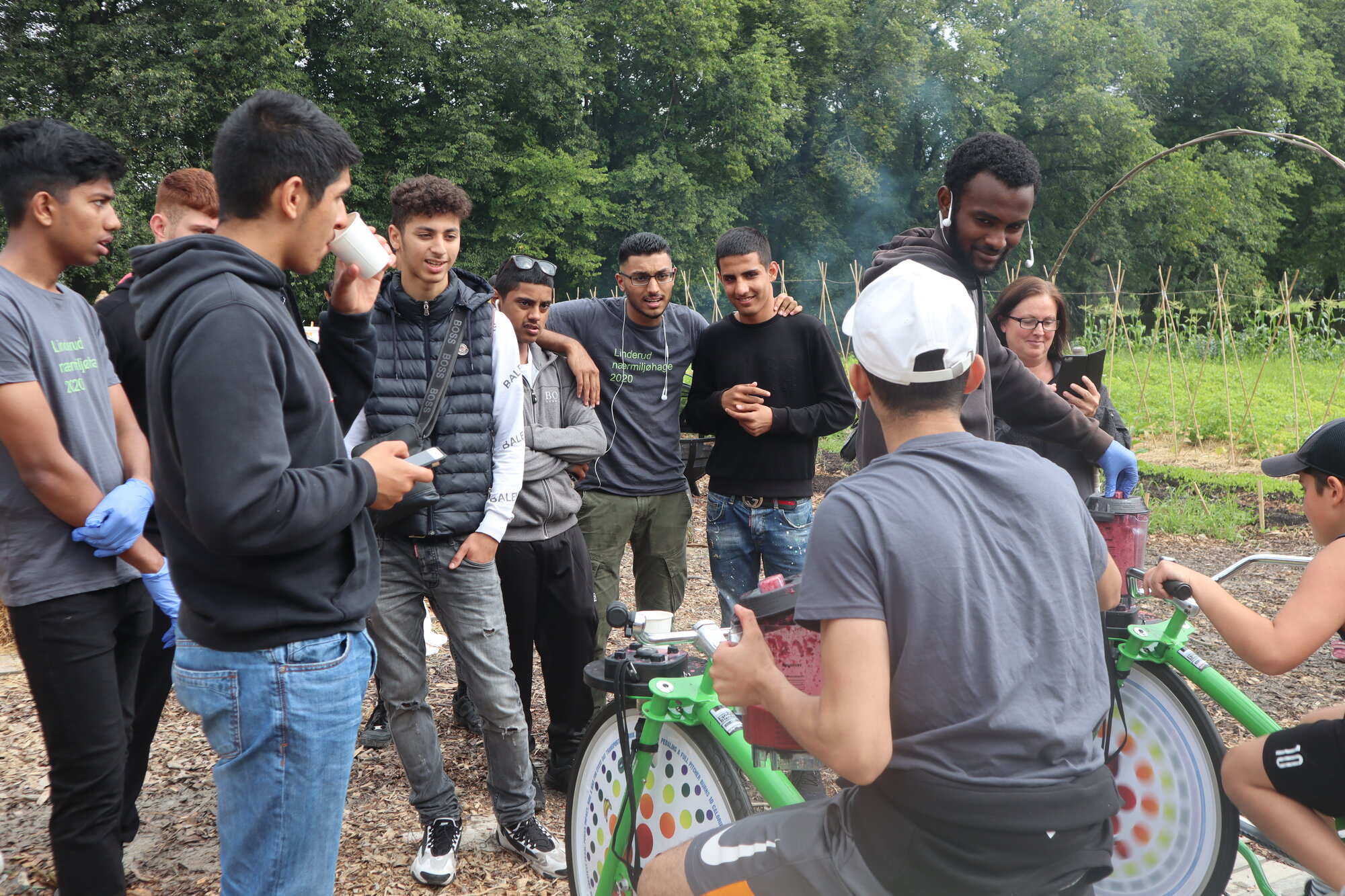 Image 5. Youth gathering around the smoothie bikes during an event at Linderud farm. Source: Kimberly Weger.